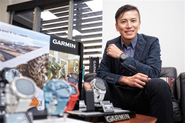 A person sitting in front of garmin watchDescription automatically generated A person sitting in front of garmin watchDescription automatically generated