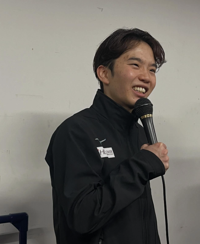 Kazuki Tomono with a microphone