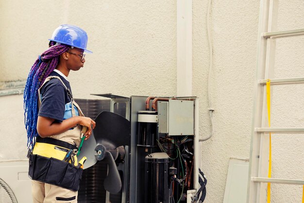 Air Conditioning Repair Service Technician Diagnosing AC Unit