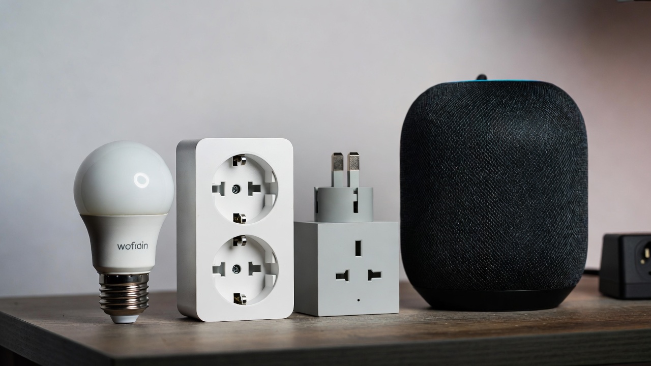 A collection of beginner-friendly IoT devices including smart bulbs, plugs, and a smart speaker on a desk