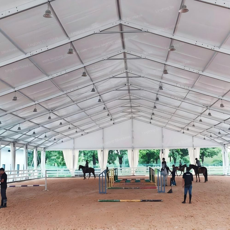 Prefabricated horse arena tent interior with clear span space for equestrian training and riding