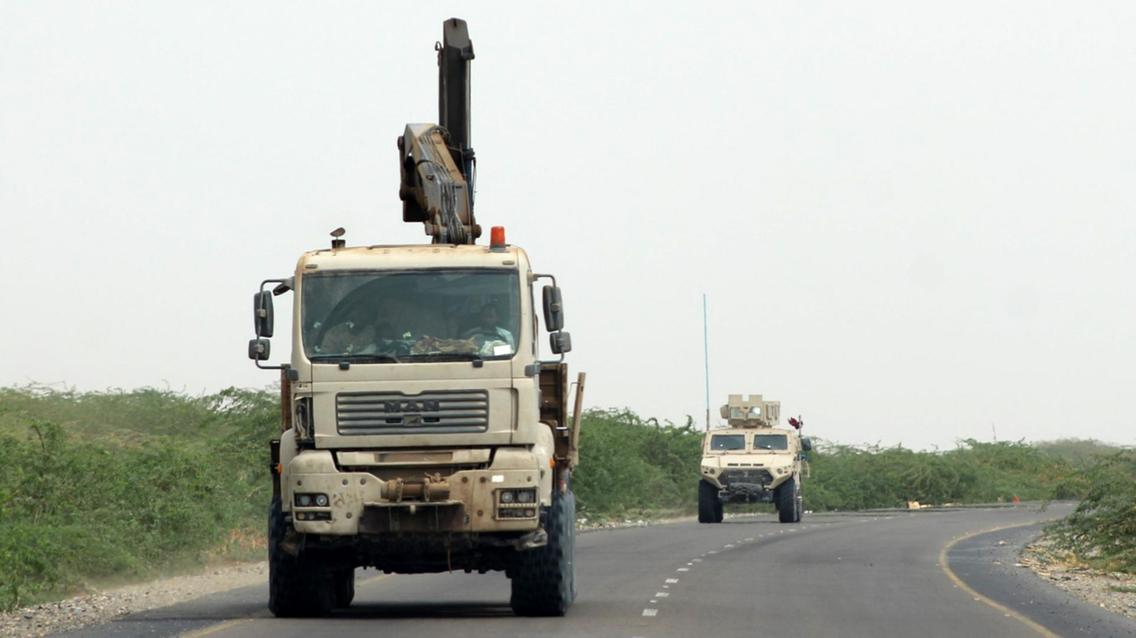 Amaliqa-a-truck-and-an-armoured-car.jpg