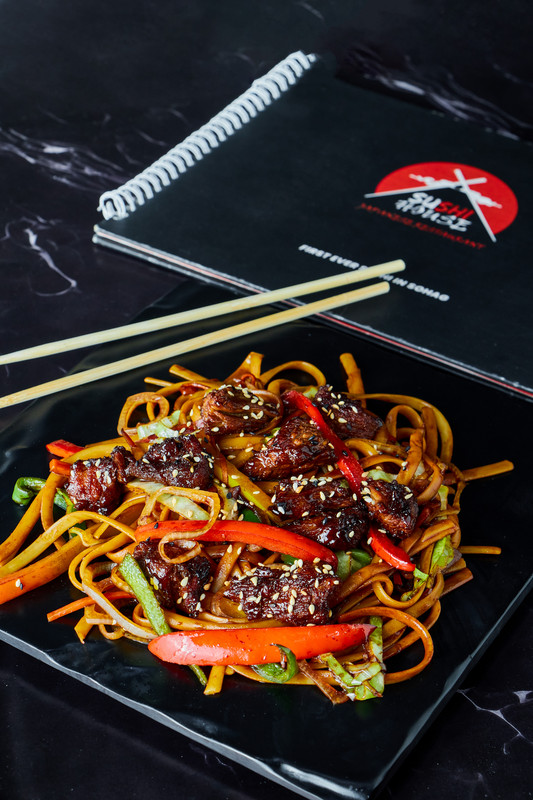 Close-up of a variety of colorful sushi pieces.