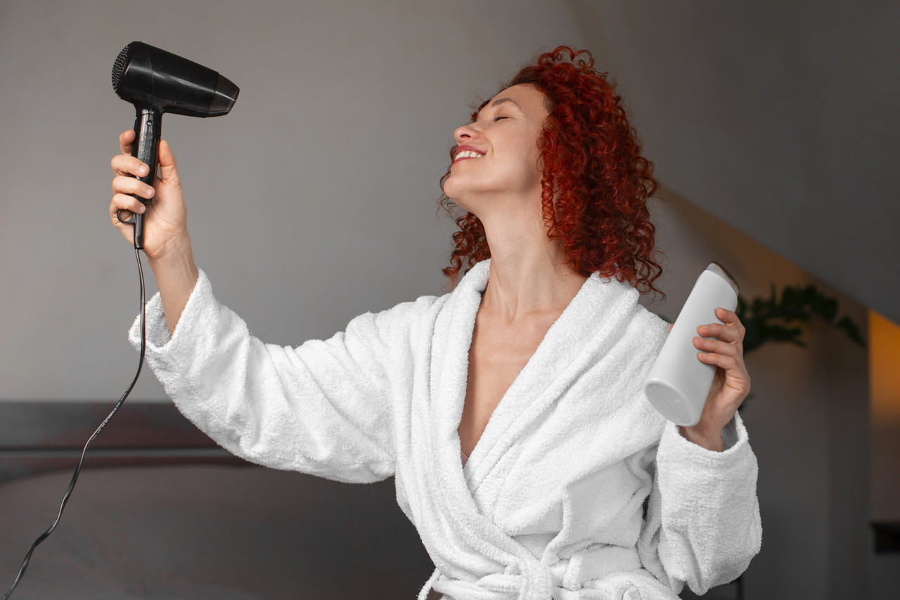medium shot young woman with curly hair