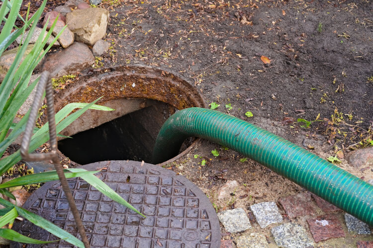 Diagram of septic tank components showing proper maintenance points