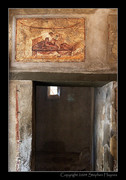 Entrance to a brothel cubicle with fresco above
