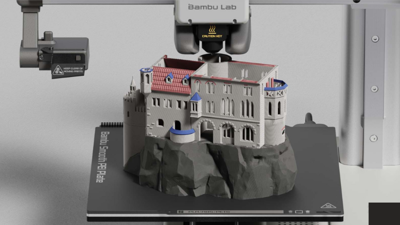 Impressora 3D Bambu Lab A1 Mini com sistema AMS Lite multicolorido em uso