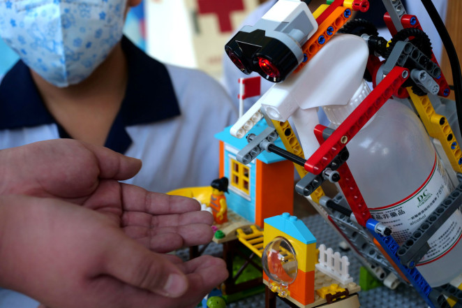 Lego Robot that dispenses hand sanitiser