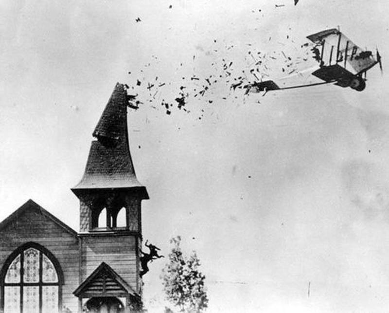 biplane hits steeple