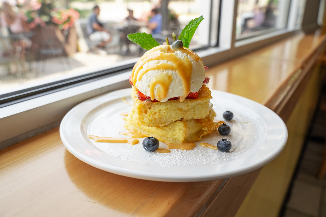 Brunch dessert food photography with shortcake, ice cream, berries, caramel, and natural window light