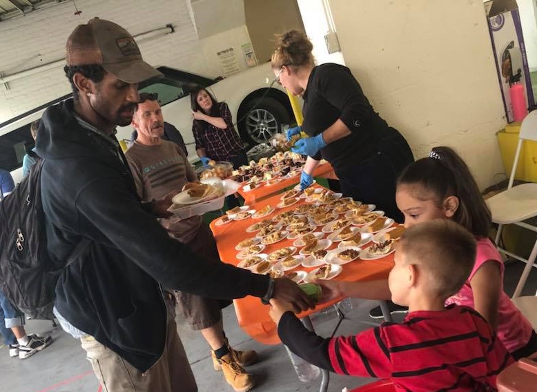 Several StaxUP Storage Team Members brought their children along and promptly put them to work on the food line at Ballpark Self Storage in Downtown San Diego, CA.