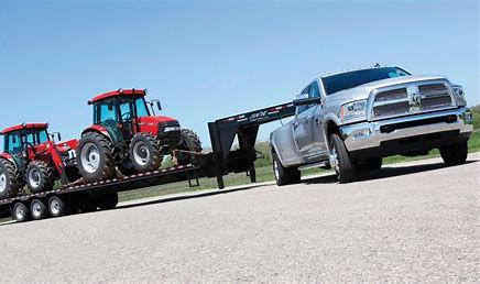 Hotshot hauling farm equipment
