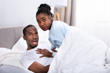 Young couple arguing about relationship betrayal