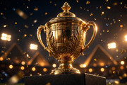 Golden squash championship trophy under floodlights with pyramid silhouettes at night