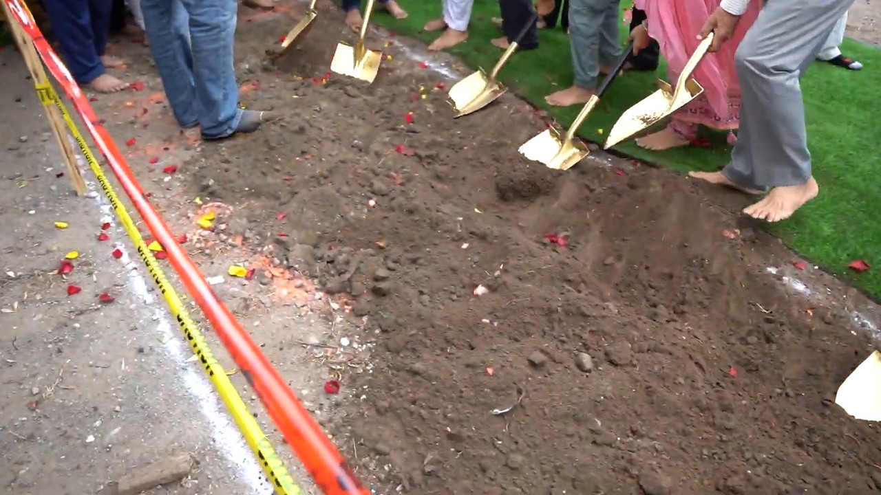 Golden ceremonial shovels breaking the soil at the Gurudwara Sahib groundbreaking in Oshawa