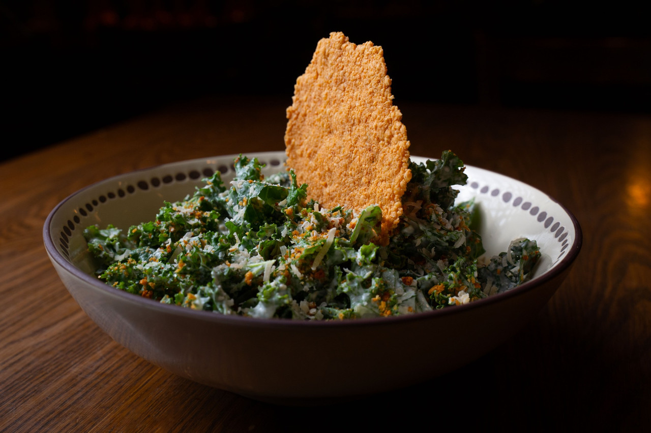 Healthy restaurant salad photography with kale, vegetables, and composed plating in Chicago