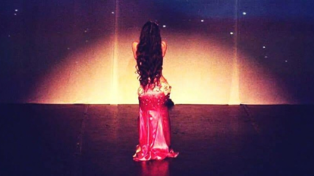Erene performing Oriental dance with a veil