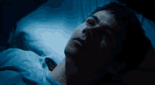 thomas-maze-runner-laying-down-staring-dylan-o-brien.gif