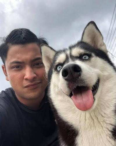Pet owner with their pet during a grooming or at-home care moment