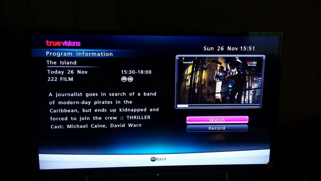 EPG: 'A journalist goes in search of a band of modern-day pirates in the Caribbean, but ends up kidnapped and forced to join the crew [...] Cast: Michael Caine, David Warn[er]' Inset: Ewan McGregor and Steve Buscemi having a casual chat and drinking some beer in the Michael Bay film