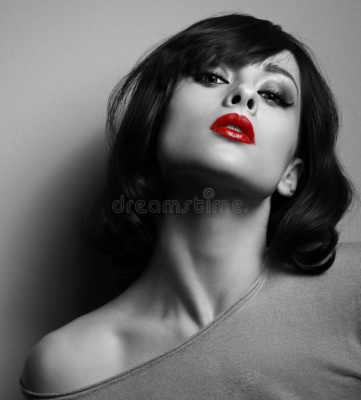 sexy-model-short-hair-style-red-lips-black-white-posing-dark-background-54221013.jpg