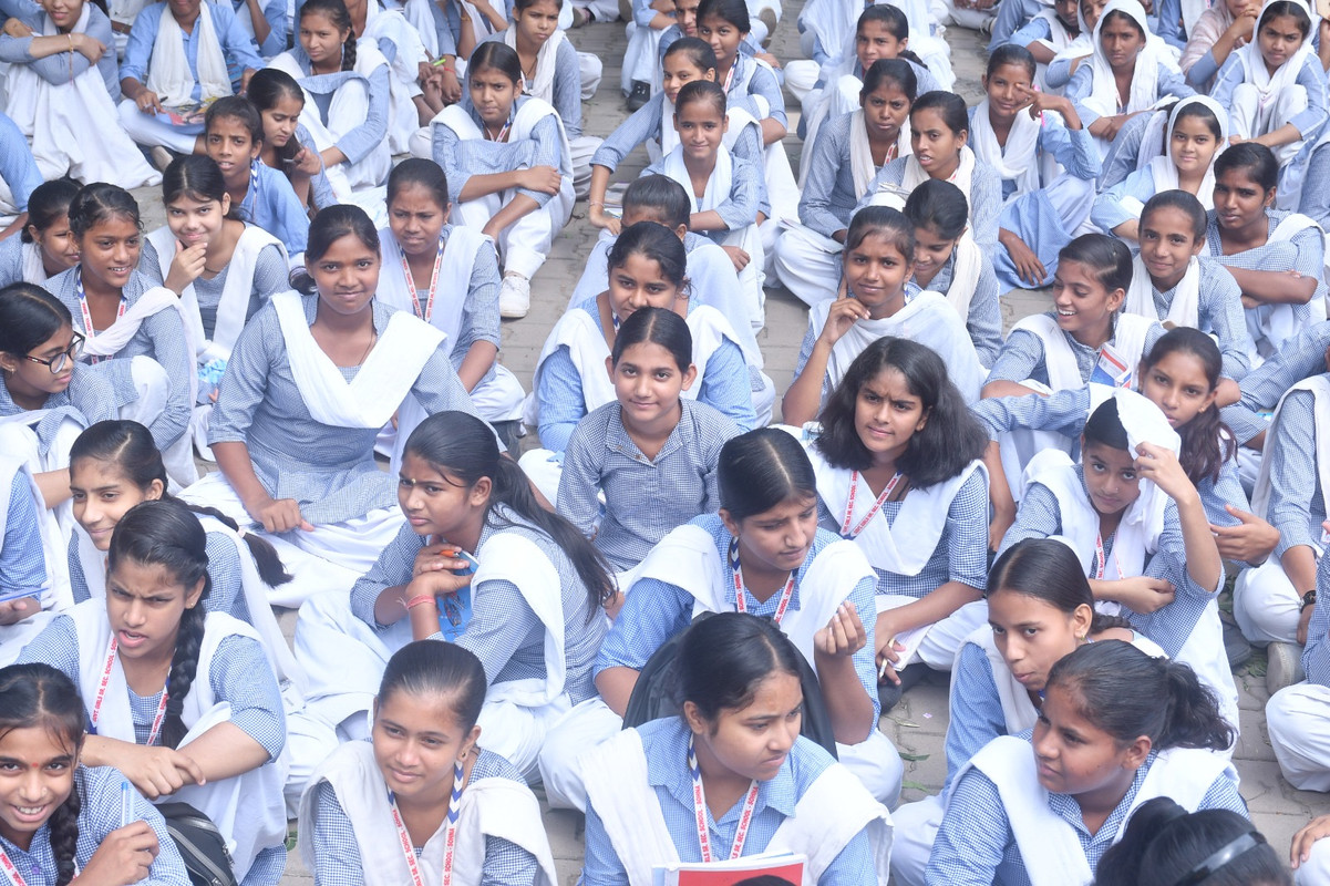 Hands holding a 'Make a Change' note