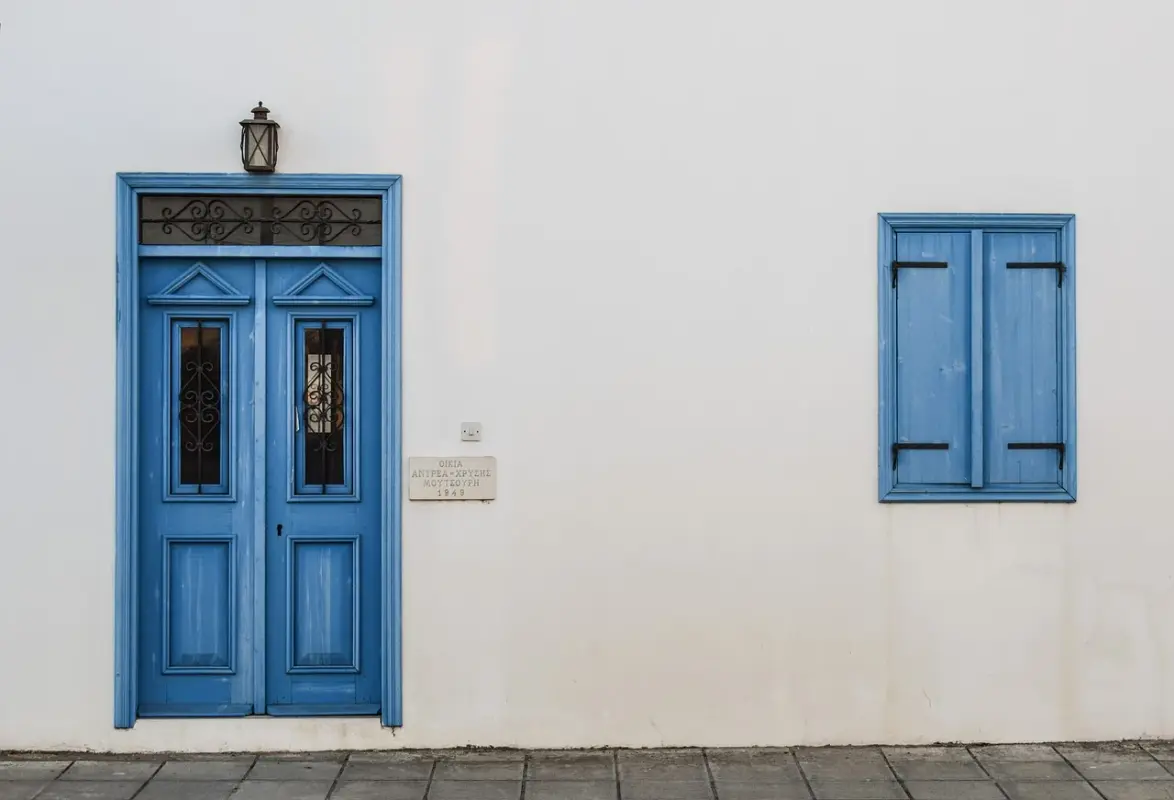 blue-door-shutter.webp