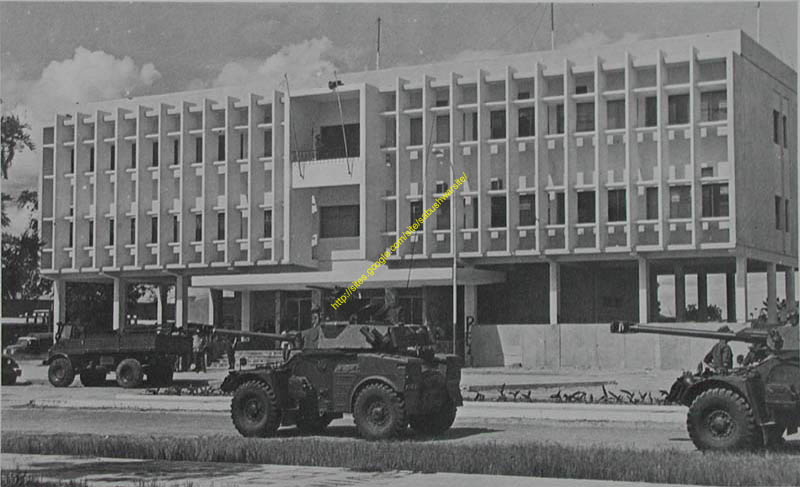 A-SADF-armoured-column-passing-through-a-Angolan-town.jpg