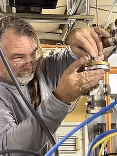 Engineer installing a Spinner component