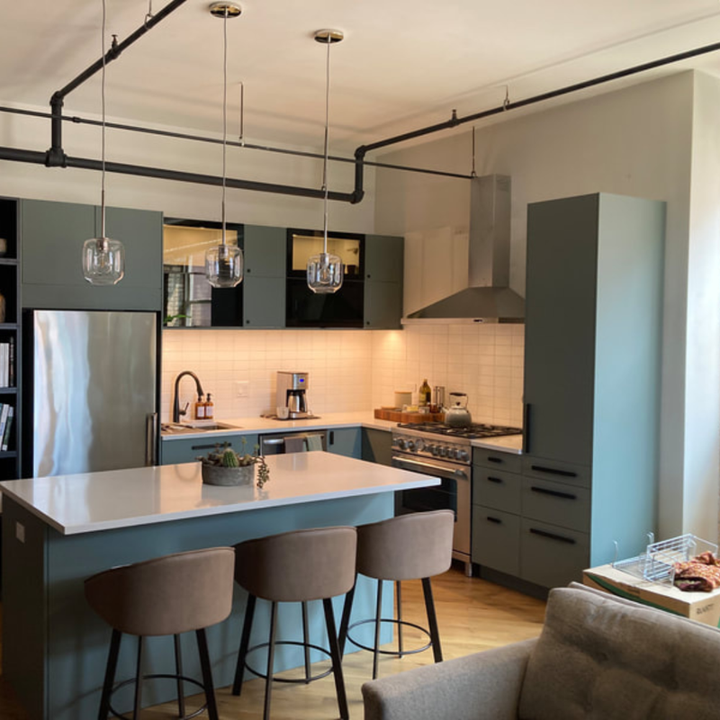 After: Modern industrial River North loft kitchen with premium materials and custom finishes