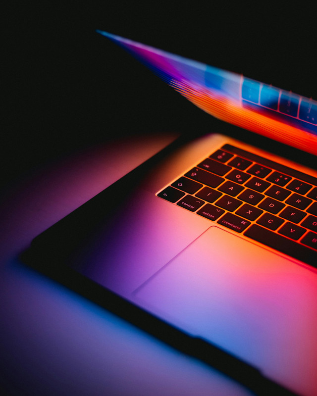 Powerful AI photo editing laptop displaying image enhancement software