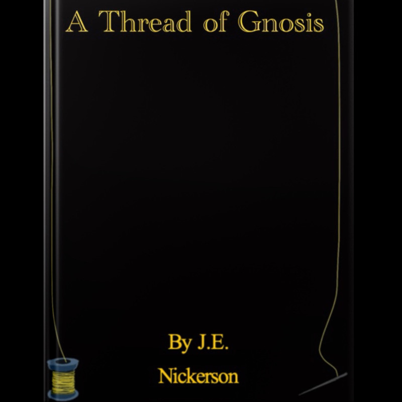 Black book with gold thread detailing around the edges, resting on a neutral surface.