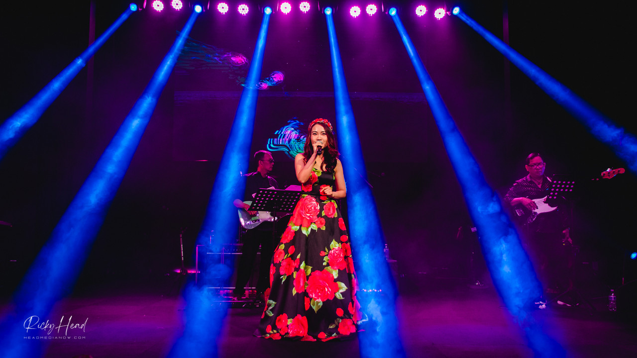 Hey there, everyone! I just wanted to give a shoutout to Kim Thao, our great MC tonight. She's a proud Seattleite who is taking charge and directing the show with style and grace. Kim is hardly a stranger to the stage. Let's throw a round of applause to Kim Thao, our excellent master of ceremonies! - Photo by Ricky Head