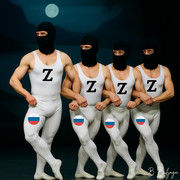 Muscular men in ballet tutus and balaclavas, with Russian symbols, perform ballet on stage.