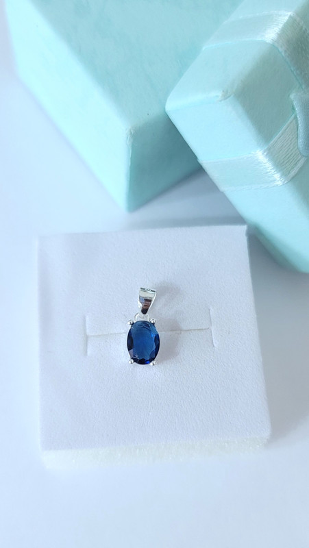 Dije ovalado azul