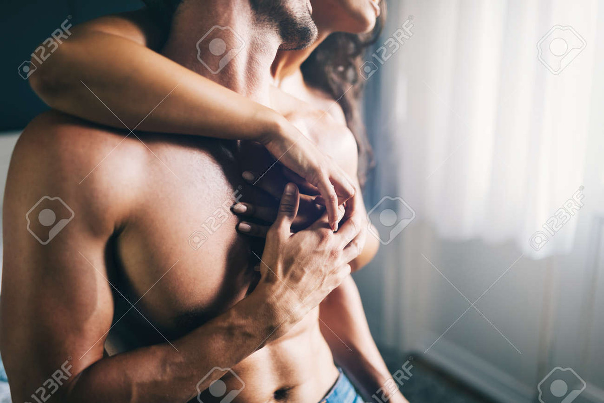 116721880-young-sexy-hot-couple-in-love-hugging-and-kissing