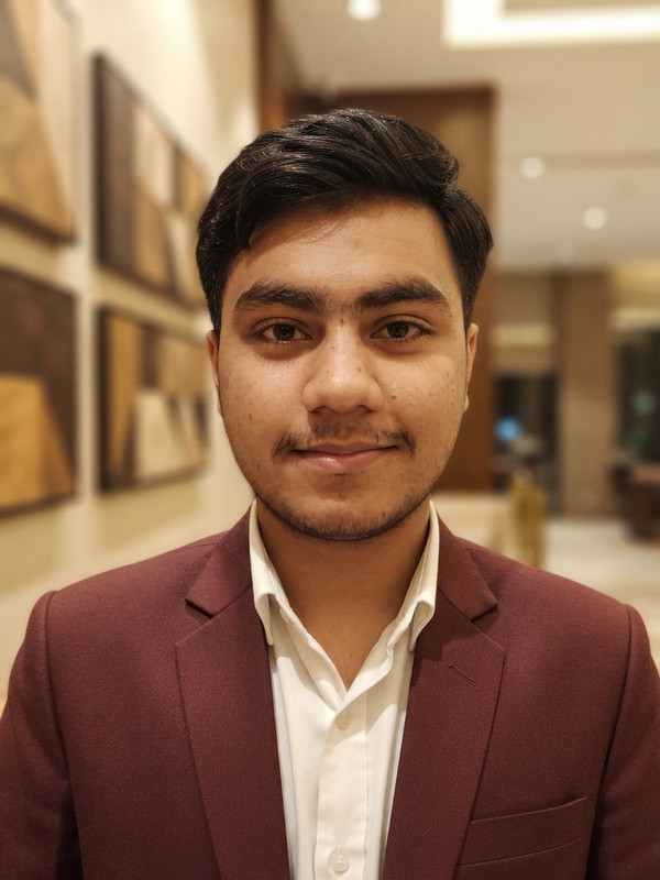 AI-generated example result for the creative-images prompt: Burgundy Blazer Office Smile AI Portrait Prompt | Prompt Craft