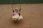 happy-girl-on-swing-in-her-4akid-smitten-pastel-sherbet-pettitop-and-pettiskirt