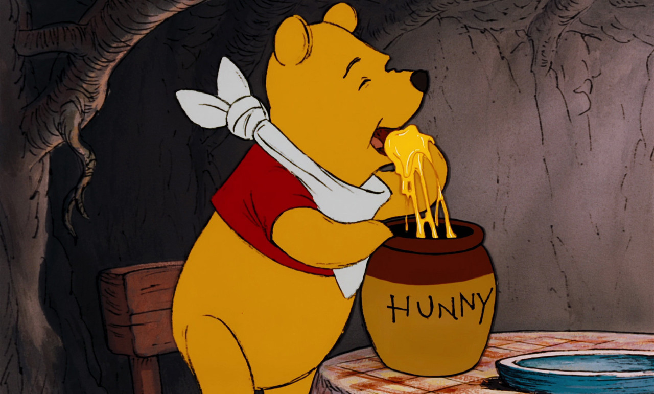 Winnie_the_Pooh_is_about_to_eat_honey