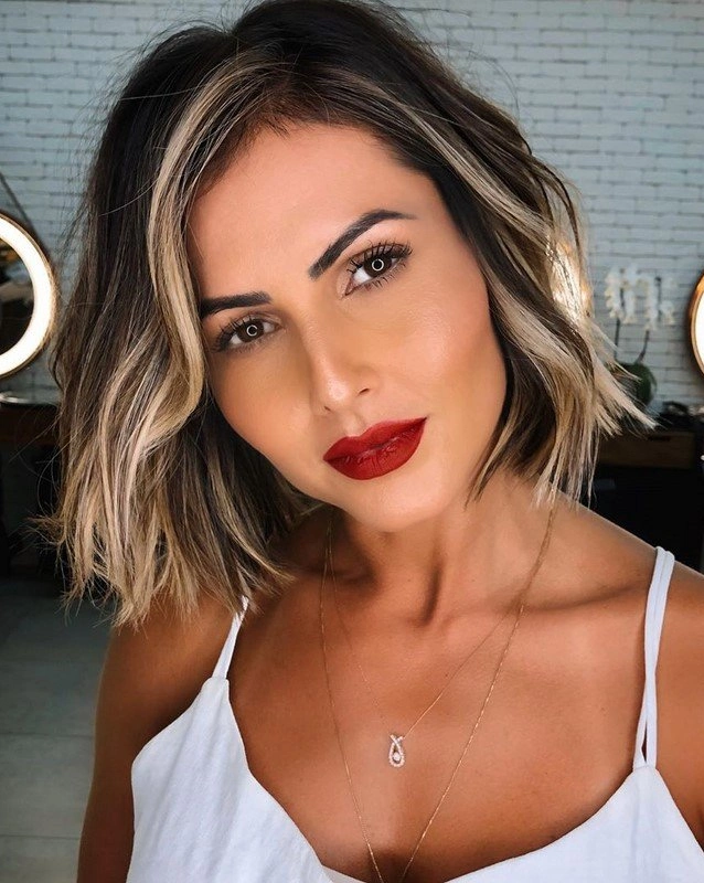 Beige blonde hair highlights on brunette