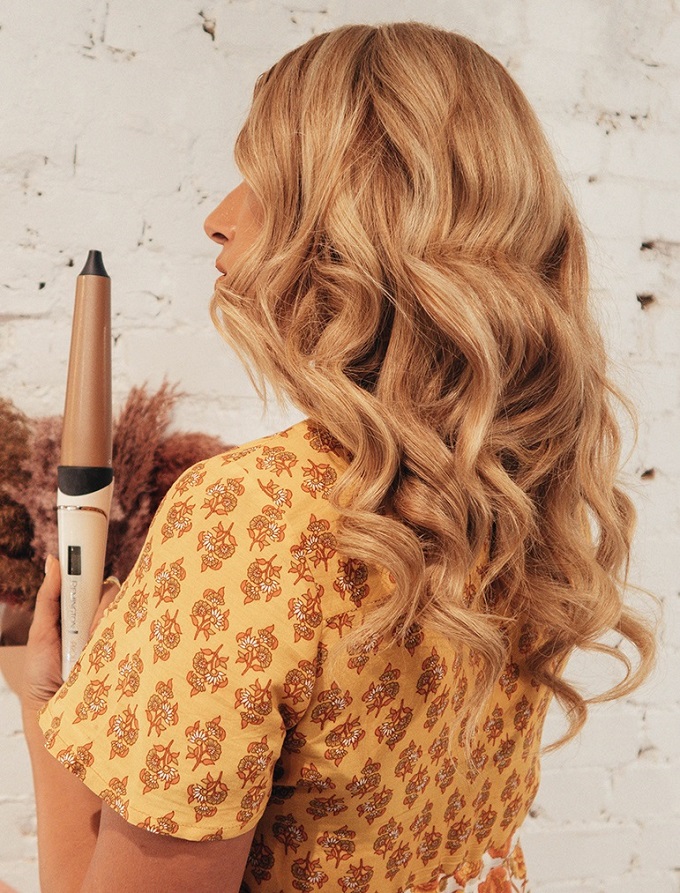 Large curling wand styled hair