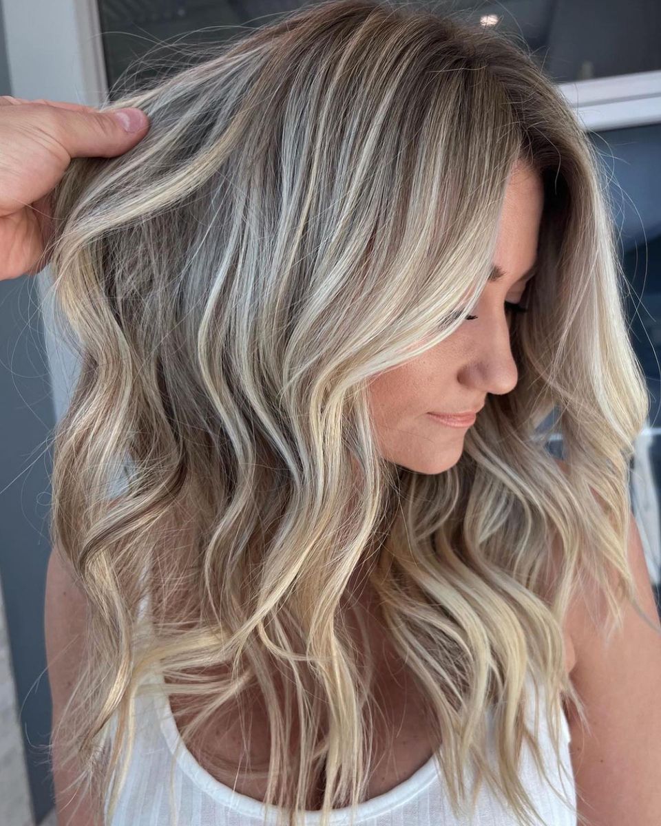 Brown long wavy hair dyed in sandy beige color
