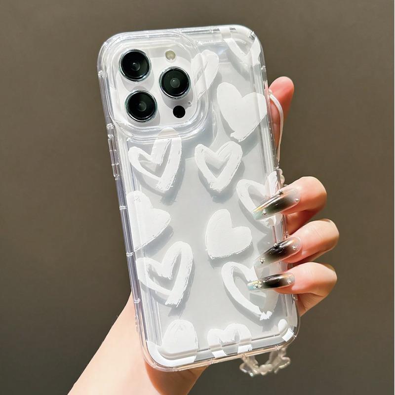 Foto de Funda transparente con diseño corazón. Incluye correa de mano.