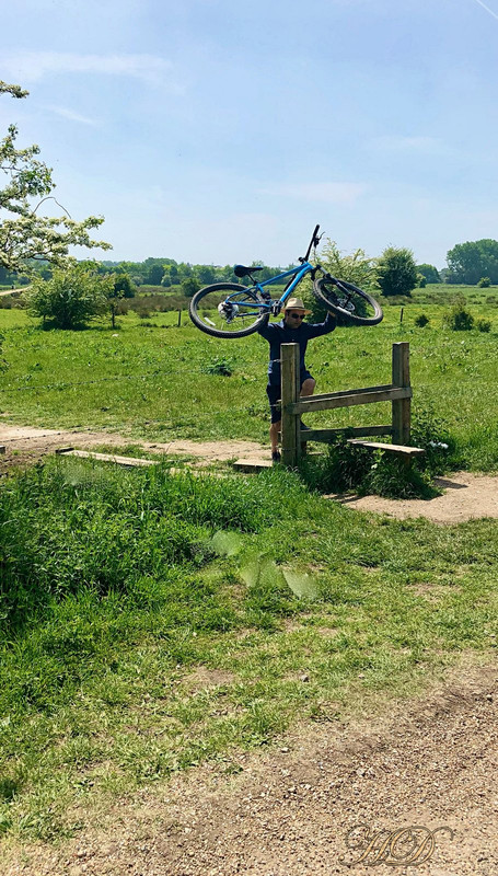 man-with-bike-at-stile-HD.jpg