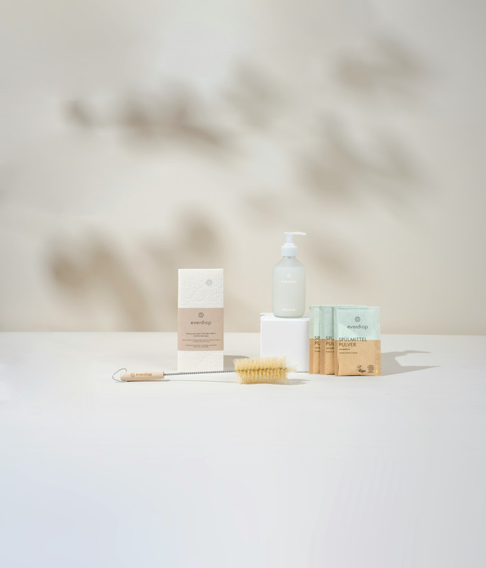 Minimalist skincare products arranged on a clean white surface