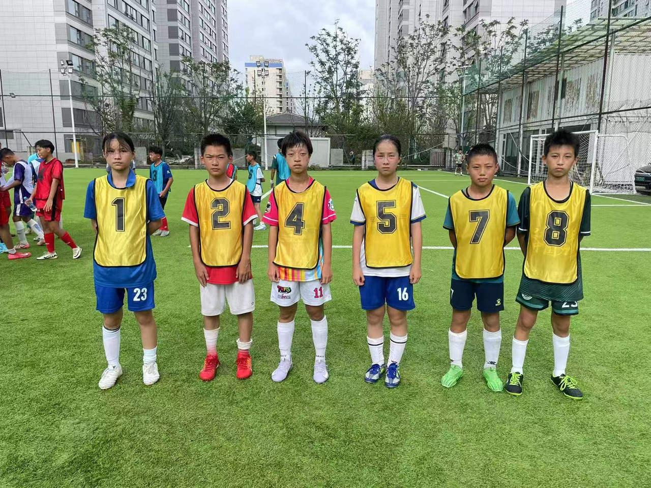 A football on a lush green pitch.
