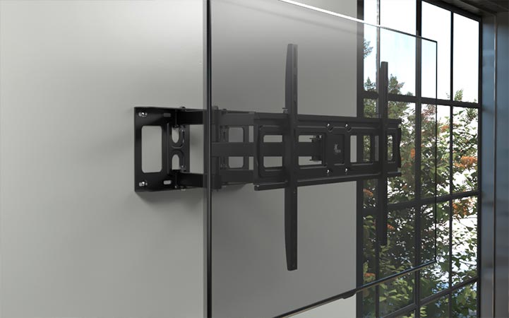 Soporte de pared articulado Xtech sosteniendo un televisor de gran tamaño.