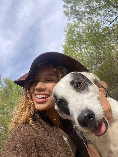 Pet owner with their pet during a grooming or at-home care moment