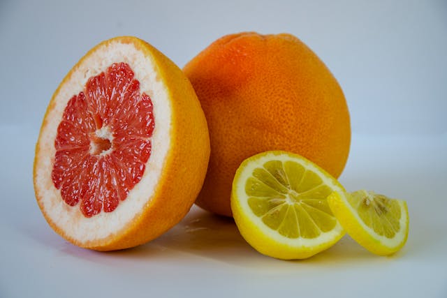 Grapefruit, lemon and orange placed on a table