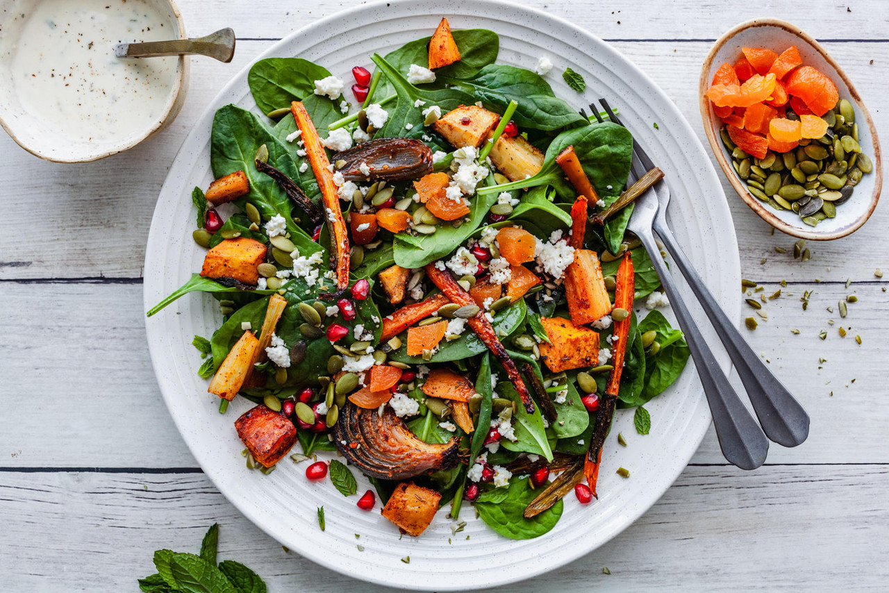 Colorful roasted vegetable salad with tahini dressing